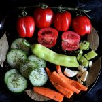 Healthy salad with tomatoes, cucumber, bell pepper, carrot, onion and spices